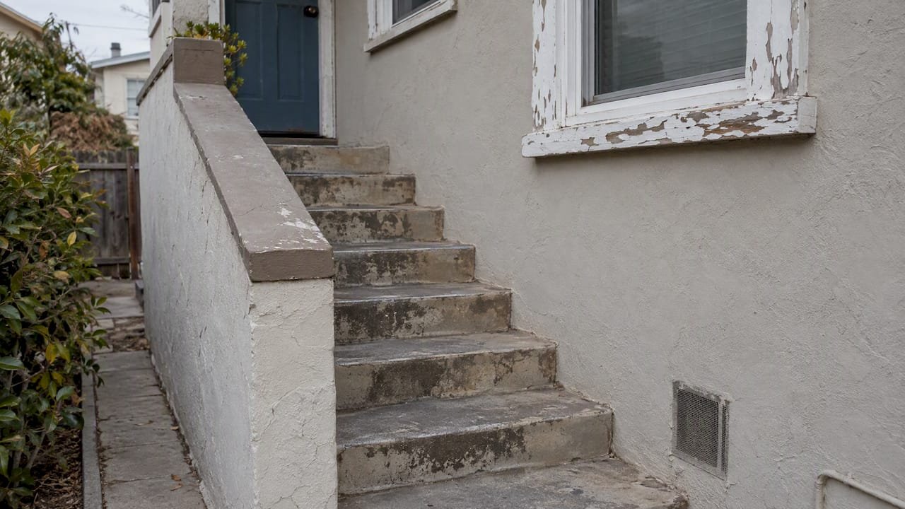 Older home stairway missing a handrail